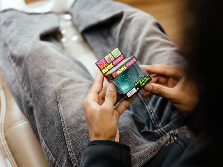 A patient holding a fidget cube during their visit at Norwood Dental Centre