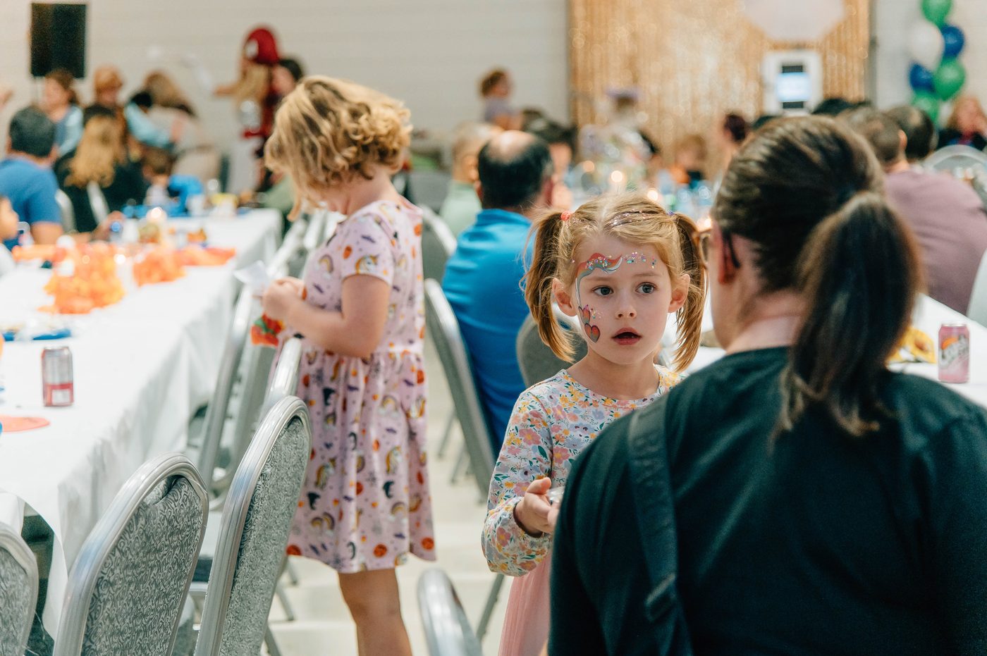 Children with face paint at a Norwood Dental Centre community event