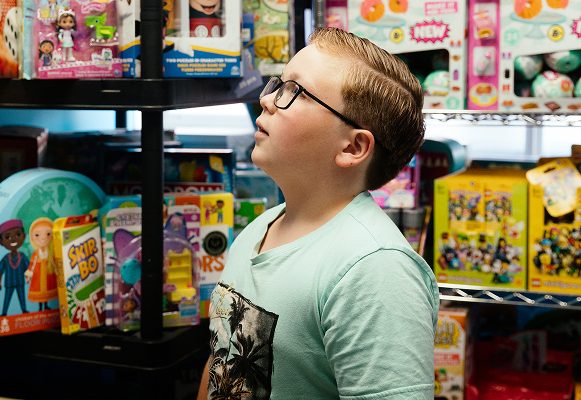 A child choosing a free toy from the Norwood Dental Centre toy room